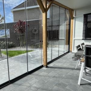 Glazen schuifwand voor veranda